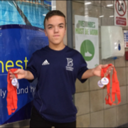 Leo McCrea holding his 4 medals at the National Para-Swimming 2017 Championships at Manchester